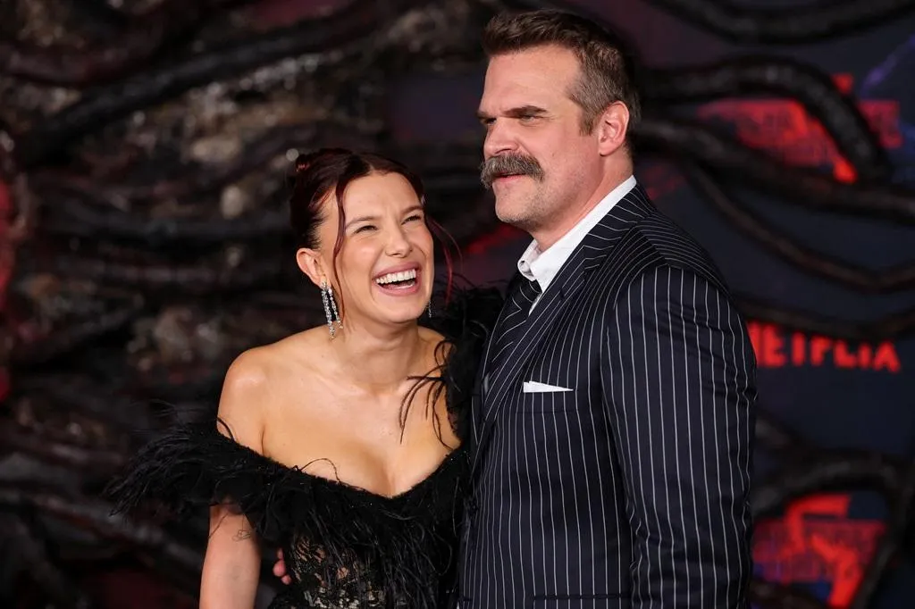 David Harbour and Millie Bobby Brown all smiles at Stranger Things red premiere amid 'bullying' claims | The Standard